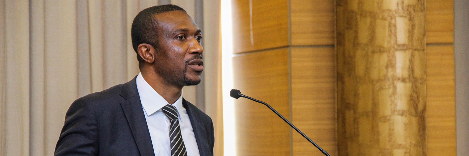 A person speaking through mic A person speaking through mic