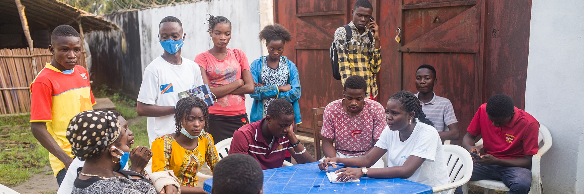 A group people sitting around a table A group people sitting around a table